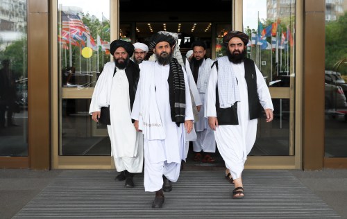 Members of a Taliban delegation, led by chief negotiator Mullah Abdul Ghani Baradar (C, front), leave after peace talks with Afghan senior politicians in Moscow, Russia May 30, 2019. REUTERS/Evgenia Novozhenina - RC1C12362C10
