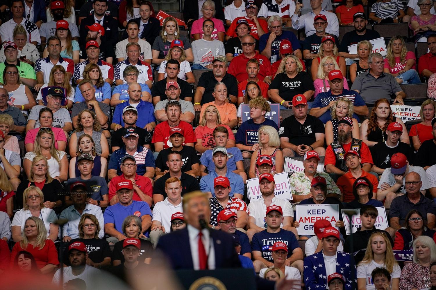 Supporters of U.S. President Donald Trump look on as Trump speaks during a campaign rally in Cincinnati, Ohio, U.S., August 1, 2019.   REUTERS/Bryan Woolston - RC179FD13B60