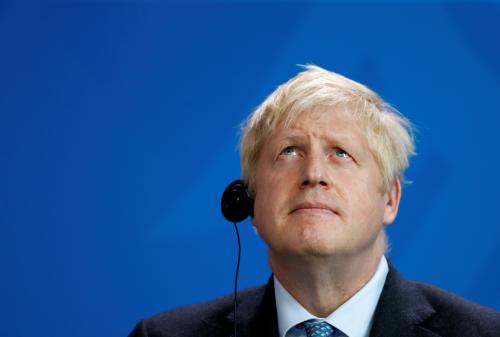 Britain's Prime Minister Boris Johnson looks on during a news conference with German Chancellor Angela Merkel (not pictured) at the Chancellery in Berlin, Germany August 21, 2019. REUTERS/Fabrizio Bensch - RC166D642A70