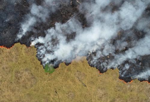 An aerial view shows smoke rising over a deforested plot of the Amazon jungle in Porto Velho, Rondonia State, Brazil, in this August 24, 2019 picture taken with a drone. Picture taken August 24, 2019. REUTERS/Ueslei Marcelino     TPX IMAGES OF THE DAY - RC180A432CE0