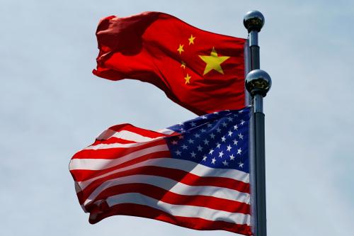 Chinese and U.S. flags flutter near The Bund, before U.S. trade delegation meet their Chinese counterparts for talks in Shanghai, China July 30, 2019.  REUTERS/Aly Song - RC187164FDE0