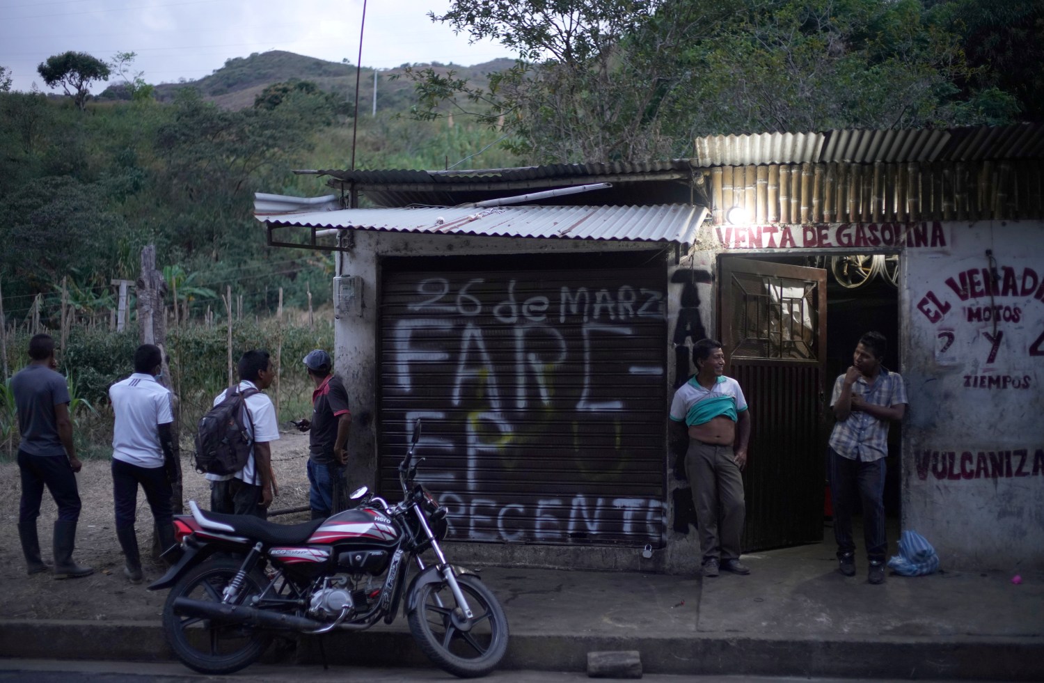 A graffiti that reads "FARC-EP present" is seen at the door of a mechanical workshop, on the road between El Palo and Toribio, where indigenous guards were killed by Revolutionary Armed Forces of Colombia (FARC) dissidents, according to the Colombian Ombudsman in Toribio, Colombia August 10, 2019. Picture taken August 10, 2019. REUTERS/Federico Rios - RC122B235D10