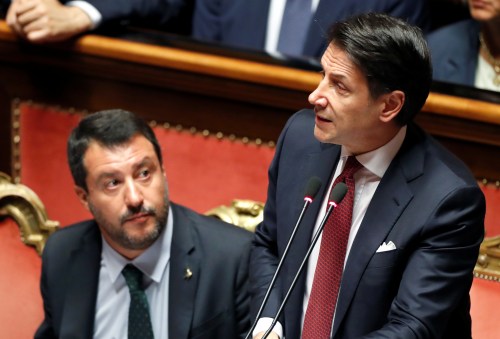 Italian Prime Minister Giuseppe Conte, next to Italian Deputy PM Matteo Salvini, addresses the upper house of parliament over the ongoing government crisis, in Rome, Italy August 20, 2019. REUTERS/Yara Nardi - RC17338CA110