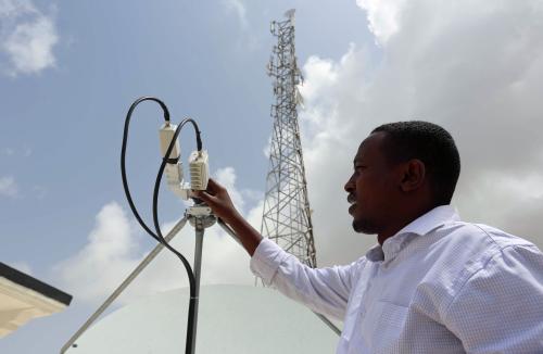 A Somali Optical Networks (SOON) technician checks a satellite dish at their headquarters in Mogadishu Somalia, July 12, 2017. Picture taken July 12, 2017. REUTERS/Feisal Omar - RC1670274D90