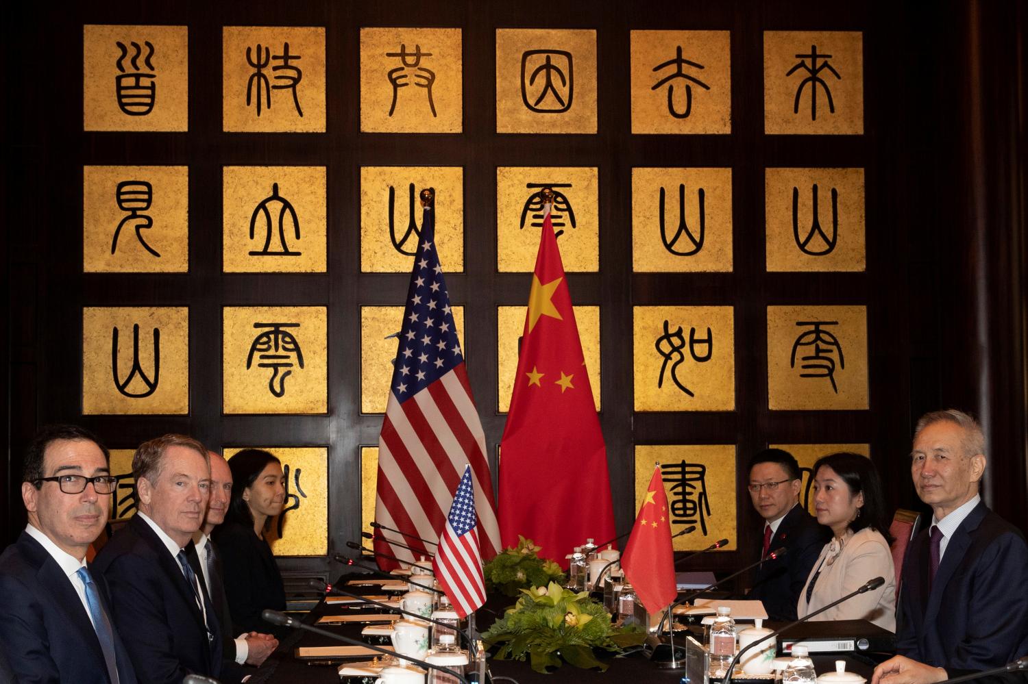 REFILE - CORRECTING NAME AND REMOVING POSITIONING Chinese Vice Premier Liu He with United States Trade Representative Robert Lighthizer and Treasury Secretary Steven Mnuchin are seen before the start of talks at the Xijiao Conference Center in Shanghai, China July 31, 2019. Ng Han Guan/Pool via REUTERS - RC1EB94296F0