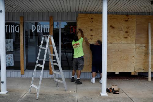 Men board up a business ahead of the arrival of Hurricane Dorian in Cocoa, Florida, U.S., September 1, 2019.  REUTERS/Marco Bello - RC182820E550
