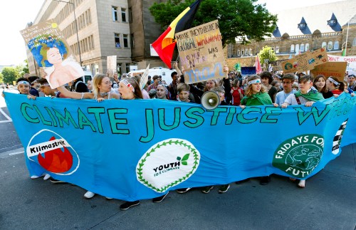 People attend a demonstration calling for action on climate change during the "Fridays for Future" demonstration in Aachen, Germany, June 21, 2019. REUTERS/Thilo Schmuelgen - RC1E9DEC43B0