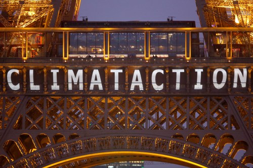 The slogan "Climate action" is projected on the Eiffel Tower as part of the World Climate Change Conference 2015 (COP21) in Paris, France, December 11, 2015.   REUTERS/Charles Platiau - LR1EBCB1BKV2N