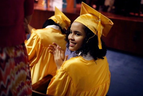 Inmate Arisleida Duarte applauds as she and others receive their high school GED (General Equivalency Diploma) along with 26 others at a graduation ceremony for inmates at the George Motchan Detention Center at New York City's Rikers Island correctional facility June 26, 2012. Two New York City agencies, the Department of Education and the Department of Correction share the responsibility of providing education to incarcerated men and women through the "East River Academy" on Rikers Island where inmates can earn their GED or High School diploma, and education staff assist in helping students to transition back to schools in the community upon their release. REUTERS/Mike Segar      (UNITED STATES - Tags: CRIME LAW EDUCATION) - GM1E86R0HDH01