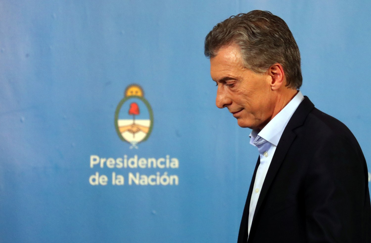 Argentina's President Mauricio Macri leaves afteer a news conference at the Olivos Presidential Residence in Buenos Aires, Argentina, July 18, 2018. Picture taken July 18, 2018. REUTERS/Marcos Brindicci - RC1FA9BE17D0