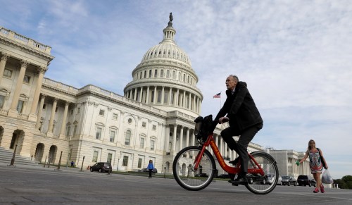 A cyclist passes the the U.S. Capitol, on the day the House is expected to vote here to repeal Obamacare in Washington, D.C., U.S., May 4, 2017. REUTERS/Kevin Lamarque - RC149622B020