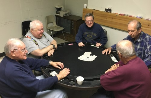 Retired steel workers Mike Pron (L to R) Jim McAndrew, Charlie Kelly, Joe Gonda and Ken Rayden play poker in a union hall in Bethlehem Pennsylvania, U.S., November 9, 2016. Among the five retirees, all life-long Democrats, only three cast ballots for Clinton in a county which voted Democratic in the past two election cycles but backed Republican Donald Trump in this year's presidential race.    REUTERS/Peter Eisler - TM3ECBA12MR01
