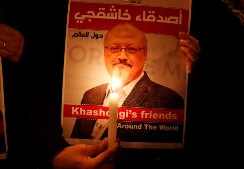 A demonstrator holds a poster with a picture of Saudi journalist Jamal Khashoggi outside the Saudi Arabia consulate in Istanbul, Turkey October 25, 2018. REUTERS/Osman Orsal - RC18135CA760