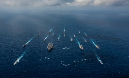The aircraft carrier USS Ronald Reagan and the Japan Maritime Self-Defense Force helicopter destroyer JS Hyuga sail in formation with 16 other ships from the U.S. Navy and the Japan Maritime Self-Defense Force as aircraft from the U.S. Air Force and Japan Air Self-Defense Force fly overhead in formation during Keen Sword in the Philippine Sea November 8, 2018.  Picture taken November 8, 2018.  Courtesy Kaila V. Peters/U.S. Navy/Handout via REUTERS. ATTENTION EDITORS - THIS IMAGE HAS BEEN SUPPLIED BY A THIRD PARTY. - RC15D8F9E720