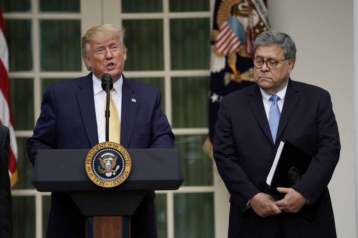 U.S. President Donald Trump stands with Attorney General Bill Barr as he announces his administration's effort to gain citizenship data during the 2020 census at an event in the Rose Garden of the White House in Washington, U.S., July 11, 2019. REUTERS/Kevin Lamarque - RC11A43F7A00