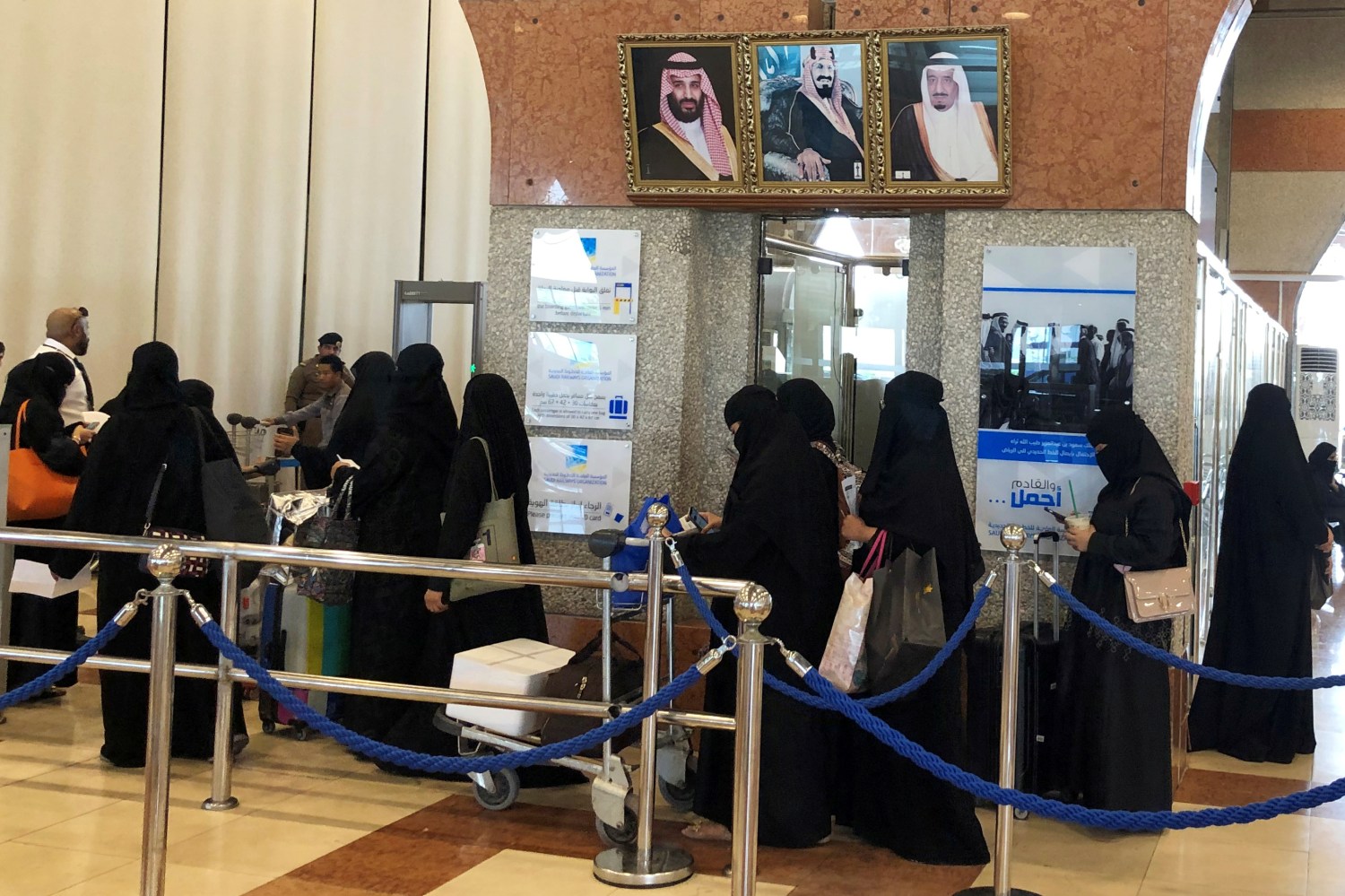 Saudi women are seen in line as they are traveling at the Dammam railway station in Dammam, Saudi Arabia, August  21, 2019. REUTERS/ Hamad I Mohammed - RC1983891420