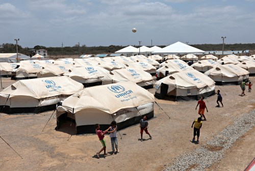 Venezuelan migrant children play soccer in a camp run by the UN refugee agency UNHCR in Maicao, Colombia May 7, 2019. Picture taken May 7, 2019. REUTERS/Luisa Gonzalez - RC144B451E30
