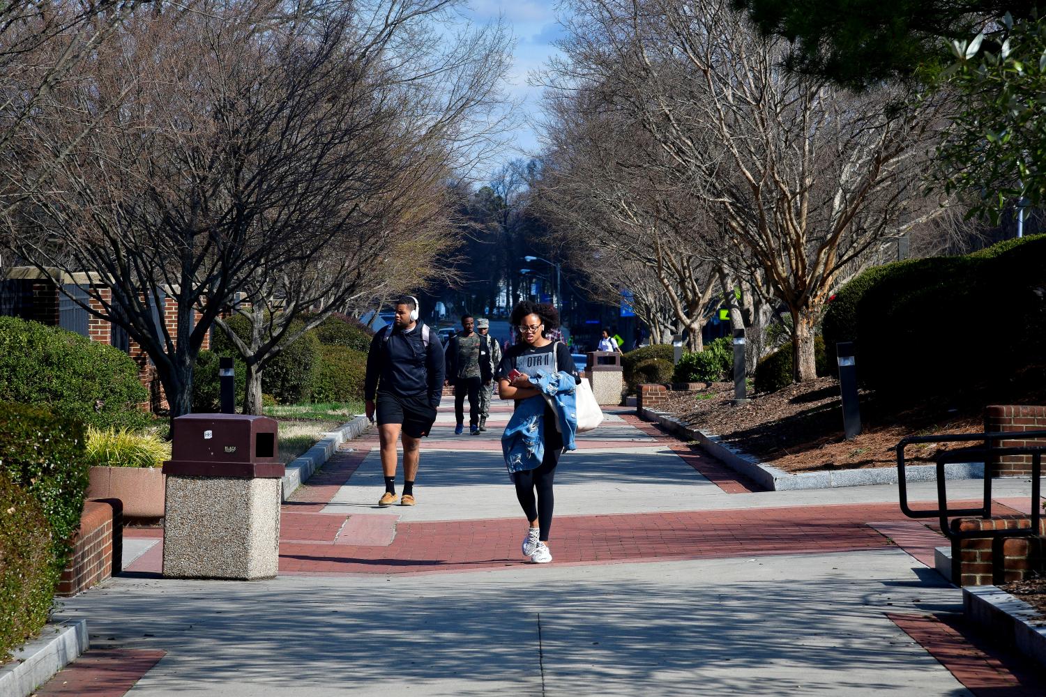 Students walk between classes at North Carolina A&T University along the line that divides Congressional Districts 13 and 6 on campus in Greensboro, North Carolina, U.S. March 14, 2019.  Picture taken March 14, 2019.  REUTERS/Charles Mostoller - RC1B16C59360