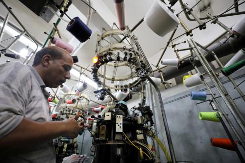 A factory employee works in a thread spinning factory in Cairo, Egypt, July 5, 2018. REUTERS/Mohamed Abd El Ghany - RC1339B685A0