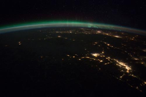 The pan-aurora borealis is visible over Vancouver, British Columbia and Seattle, Washington at night in this NASA handout photo received by Reuters on February 10, 2012. REUTERS/NASA/Handout  (CANADA - Tags: ENVIRONMENT) FOR EDITORIAL USE ONLY. NOT FOR SALE FOR MARKETING OR ADVERTISING CAMPAIGNS. THIS IMAGE HAS BEEN SUPPLIED BY A THIRD PARTY. IT IS DISTRIBUTED, EXACTLY AS RECEIVED BY REUTERS, AS A SERVICE TO CLIENTS - GM1E82B0OFX01