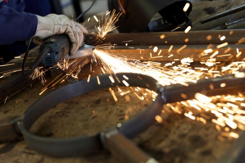 Sparks fly as an apprentice works at a training centre in Blois, central France, March 4, 2013. REUTERS/Philippe Wojazer (FRANCE - Tags: POLITICS BUSINESS EMPLOYMENT EDUCATION) - PM1E9341HEV01