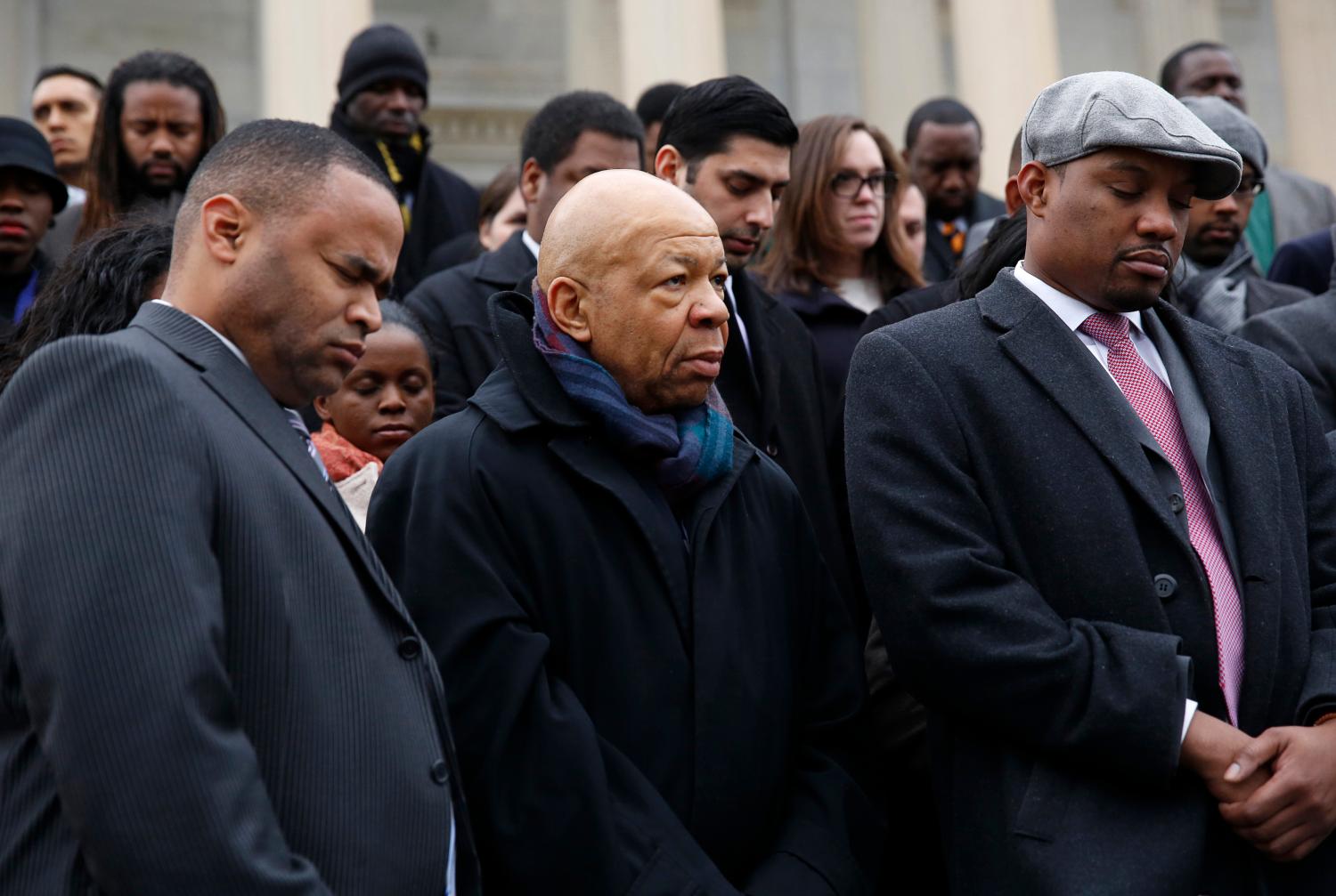 African-American Congressional staffers and representatives, including Representative Mark Veasey (D-TX) (L) and Elijah Cummings (D-MD) (C) stage a walk out on the steps of the House of Representatives at the U.S. Capitol to protest the deaths of Michael Brown and Eric Garner, in Washington December 11, 2014. REUTERS/Gary Cameron   (UNITED STATES - Tags: CRIME LAW POLITICS CIVIL UNREST) - GM1EACC0G0P01