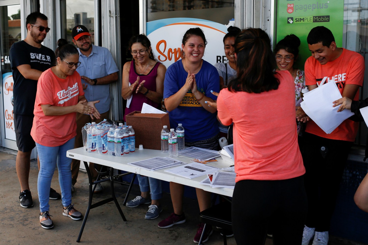 Immigration rights activists meet during a event to hand out pamphlets as communities braced for a reported wave of deportation raids across the United States by Immigration and Customs Enforcement officers, in Miami, Florida, U.S. July 13, 2019.  REUTERS/Marco Bello - RC1E69650CB0