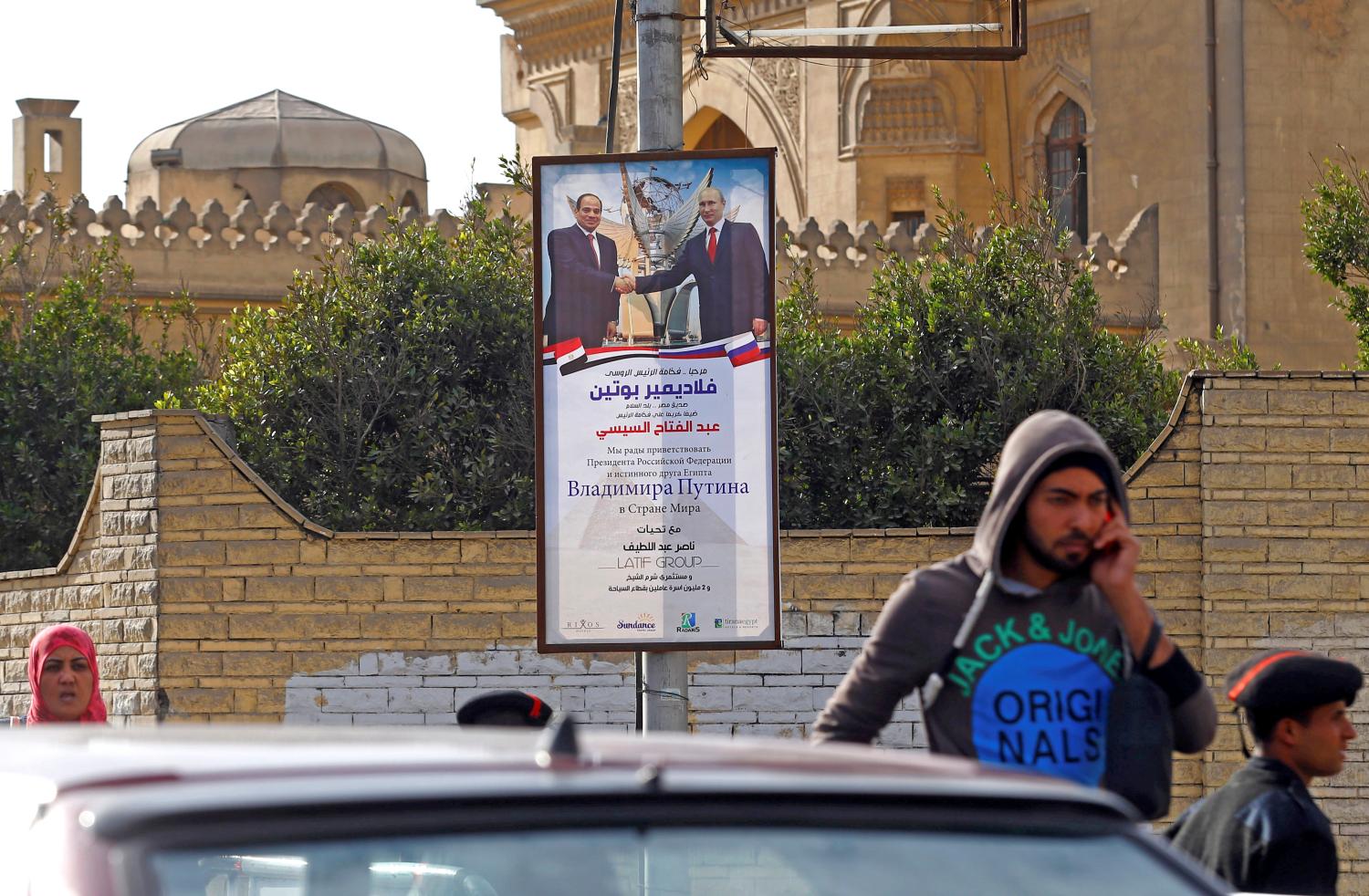 Posters of Russian President Vladimir Putin hang on the streets of Egypt's capital ahead of his meeting with his Egyptian counterpart President Abdel Fattah al-Sisi in Cairo, Egypt December 11, 2017. REUTERS/Mohamed Abd El Ghany - RC119911E330