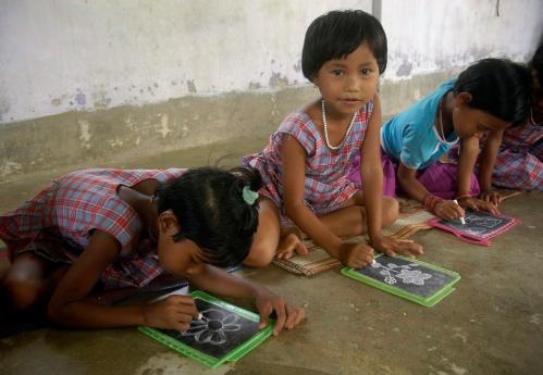 Children draw at an "anganwadi" (creche) centre under the Integrated Child Development Services (ICDS) scheme in Kutnabari village, about 45 km (28 miles) north of Agartala, capital of India's northeastern state of Tripura, August 9, 2008. The scheme aims to improve the nutritional and health status of children up to 6 years of age, pregnant women and nursing mothers from rural and tribal areas. The ICDS provides services like health check-up, immunization, pre-school education, supplementary nutrition amongst others. REUTERS/Jayanta Dey (JNDIA) - GM1E4891T1E01