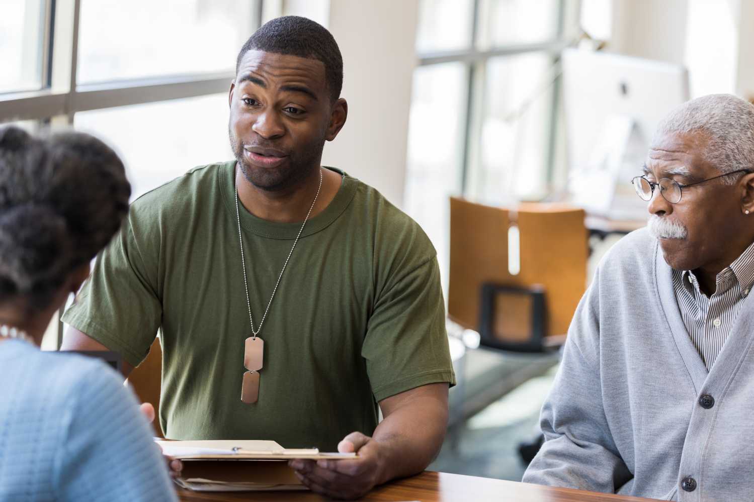 Veteran with classmates in library
