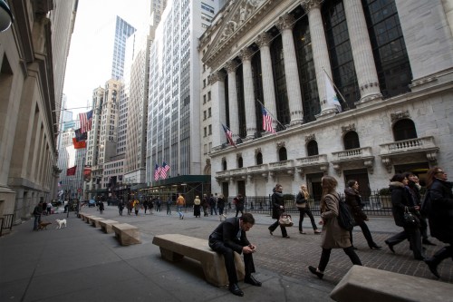 People walk by the New York Stock Exchange in New York's financial district March 11, 2014.  REUTERS/Brendan McDermid (UNITED STATES - Tags: BUSINESS) - GM1EA3C035U01