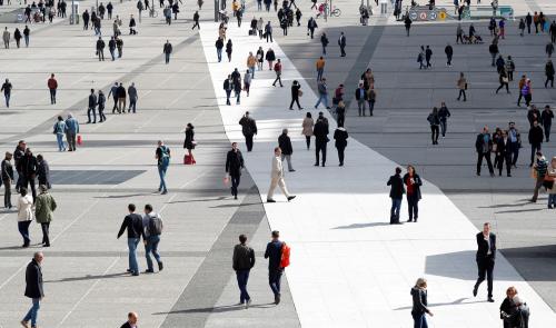 People walk on the esplanade of La Defense, in the financial and business district, west of Paris, France, October 6, 2017. REUTERS/Charles Platiau - RC1ACDEDDC80