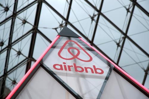 The Airbnb logo is seen on a little mini pyramid under the glass Pyramid of the Louvre museum in Paris, France, March 12, 2019. Airbnb and the Louvre museum will offer the chance to spend a night in the Louvre museum on April 30 where a contest winner with a guest will have an aperitif in front of the painting "Mona Lisa" (La Joconde) by Leonardo Da Vinci, a dinner in front of the Venus de Milo statue during a private visit and finally sleep in their own little mini pyramid under the glass Pyramid. Picture taken March 12, 2019. REUTERS/Charles Platiau - RC12045E05E0