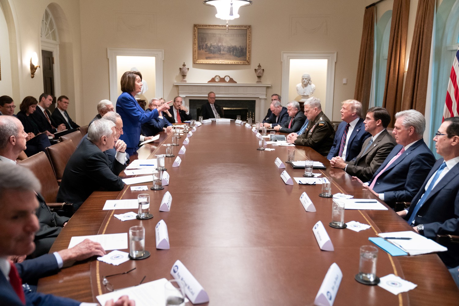 Speaker of the House Nancy Pelosi stands and speaks to U.S. President Donald Trump during an October 16 meeting about Syria between lawmakers, the president and members of the Trump administration in the White House cabinet room in an official White House handout photo released by the White House in Washington, U.S. October 17, 2019. Picture taken October 16, 2019.  Shealah Craighead/The White House/Handout via REUTERS   THIS IMAGE HAS BEEN SUPPLIED BY A THIRD PARTY. - RC175A7B6990