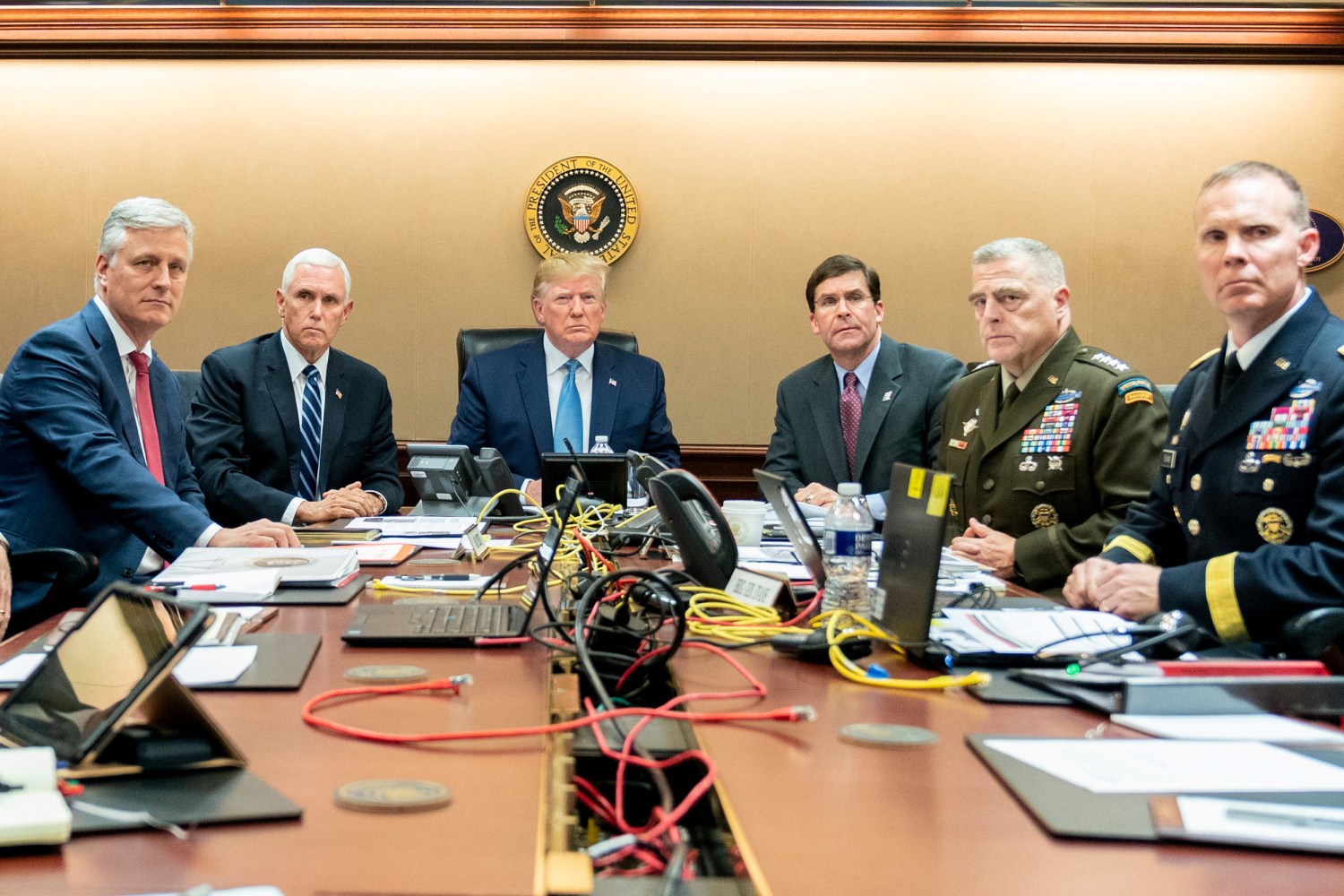 U.S. President Donald Trump, U.S. Vice President Mike Pence (2nd L), U.S. Secretary of Defense Mark Esper (3rd R), along with members of the national security team, watch as U.S. Special Operations forces close in on ISIS leader Abu Bakr al-Baghdadi, in the Situation Room of the White House in Washington, U.S., October 26, 2019. Picture taken October 26, 2019.  Shealah Craighead/The White House/Handout via REUTERS  THIS IMAGE HAS BEEN SUPPLIED BY A THIRD PARTY.     TPX IMAGES OF THE DAY - RC1CACE38AD0