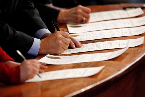 North Carolina Electoral College representatives sign the Certificates of Vote after they all cast their ballots for U.S. President-elect Donald Trump in the State Capitol building in Raleigh, North Carolina, U.S., December 19, 2016.     REUTERS/Jonathan Drake - RC12F8CC65F0