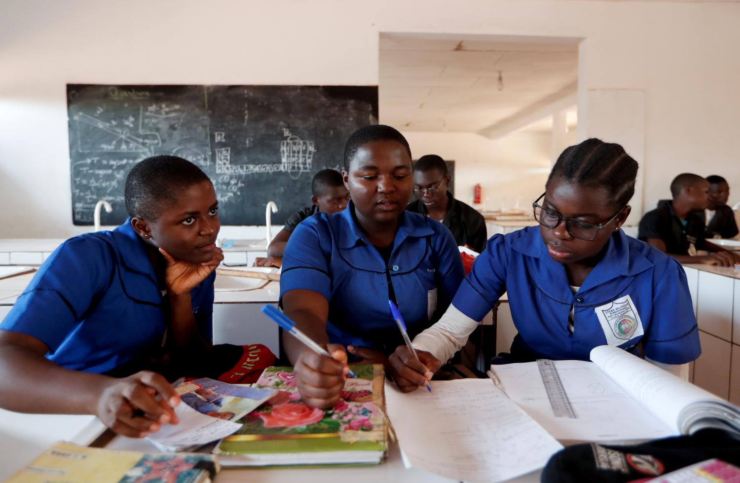 Gaelle Dule Asheri, 17, a soccer player, who is amongst the first wave of girls being trained by professional coaches at the Rails Foot Academy, attends a course at a bilingual high school as she prepares for her final baccalaureate exams in Yaounde, Cameroon, May 2, 2019. Asheri never gave up her dream despite strong opposition from her mother who feared she would lose her daughter to a "men's game". "I used to train with boys, so with boys there were some exercises I was not allowed to do because I am a girl," she said. When she first started playing soccer in the dirt streets near her home, she was the only girl on the informal neighbourhood teams. "I picked up the ball, I kicked it and I never looked back," Asheri said, recalling the childhood street soccer games with her male cousins and neighbours. REUTERS/Zohra Bensemra     SEARCH "CAMEROON GIRLS" FOR THIS STORY. SEARCH "WIDER IMAGE" FOR ALL STORIES. - RC1B9C9DB020