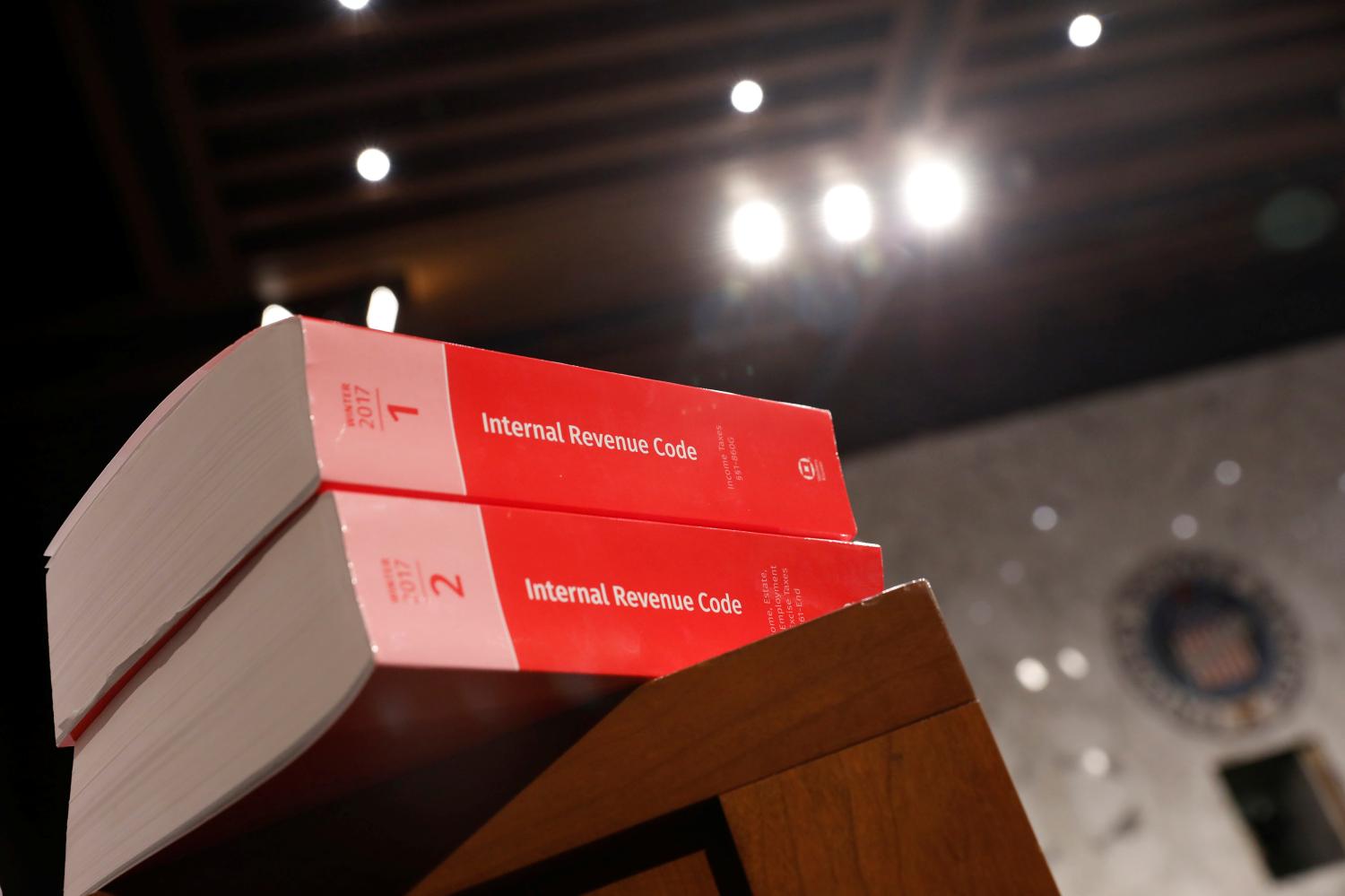 Copies of tax legislation are seen during a markup on the "Tax Cuts and Jobs Act" on Capitol Hill in Washington, U.S., November 15, 2017. REUTERS/Aaron P. Bernstein - RC163F2AC300