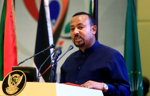 Ethiopia's Prime Minister Abiy Ahmed addresses delegates during the signing of the Sudan's power sharing deal, that paves the way for a transitional government, and eventual elections, following the overthrow of a long-time leader Omar al-Bashir, in Khartoum, Sudan, August 17, 2019. REUTERS/Mohamed Nureldin Abdallah - RC138A0BD790