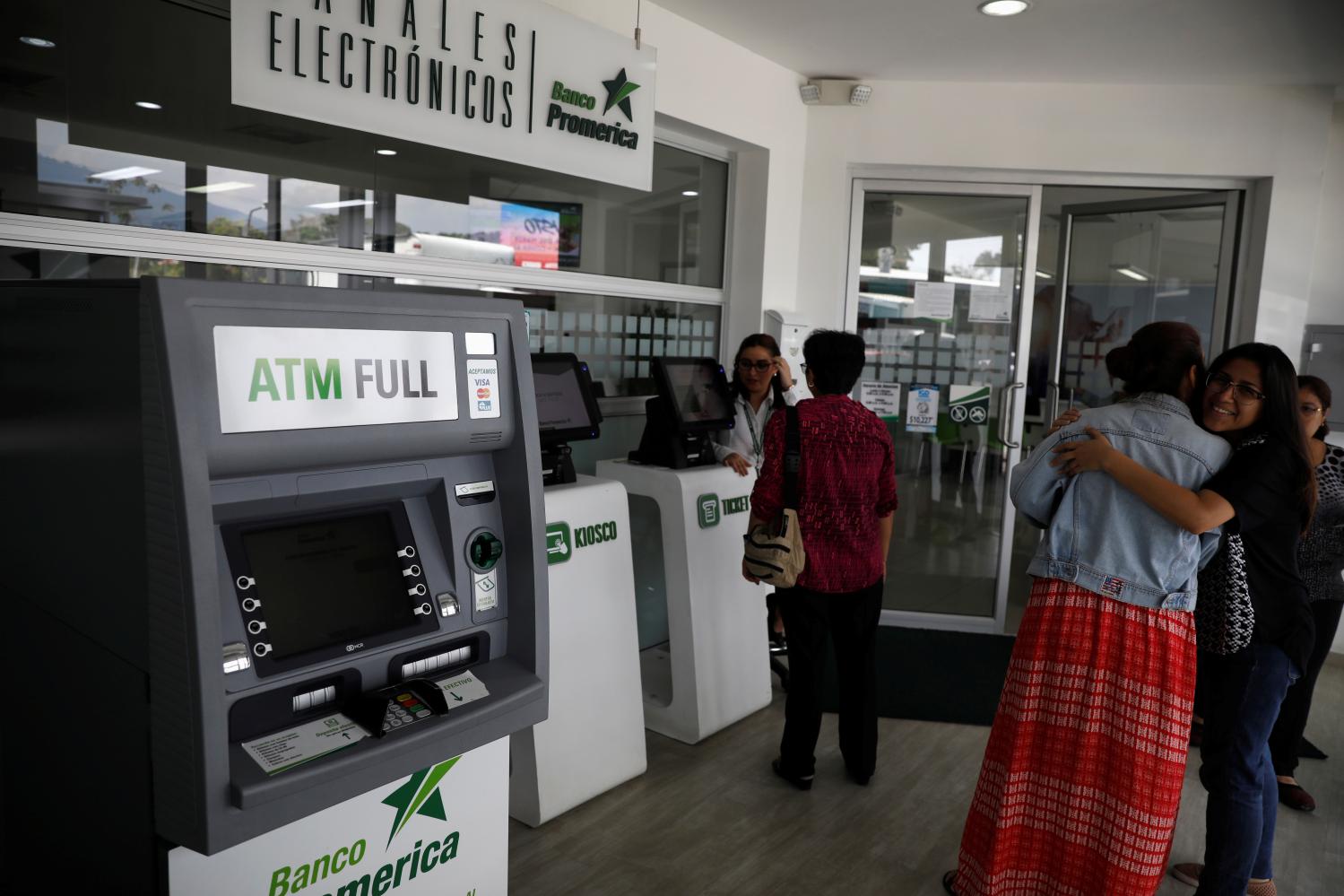 An automated teller machine (ATM) is seen in a bank in San Salvador, El Salvador April 4, 2019. REUTERS/Jose Cabezas - RC18A7449F80