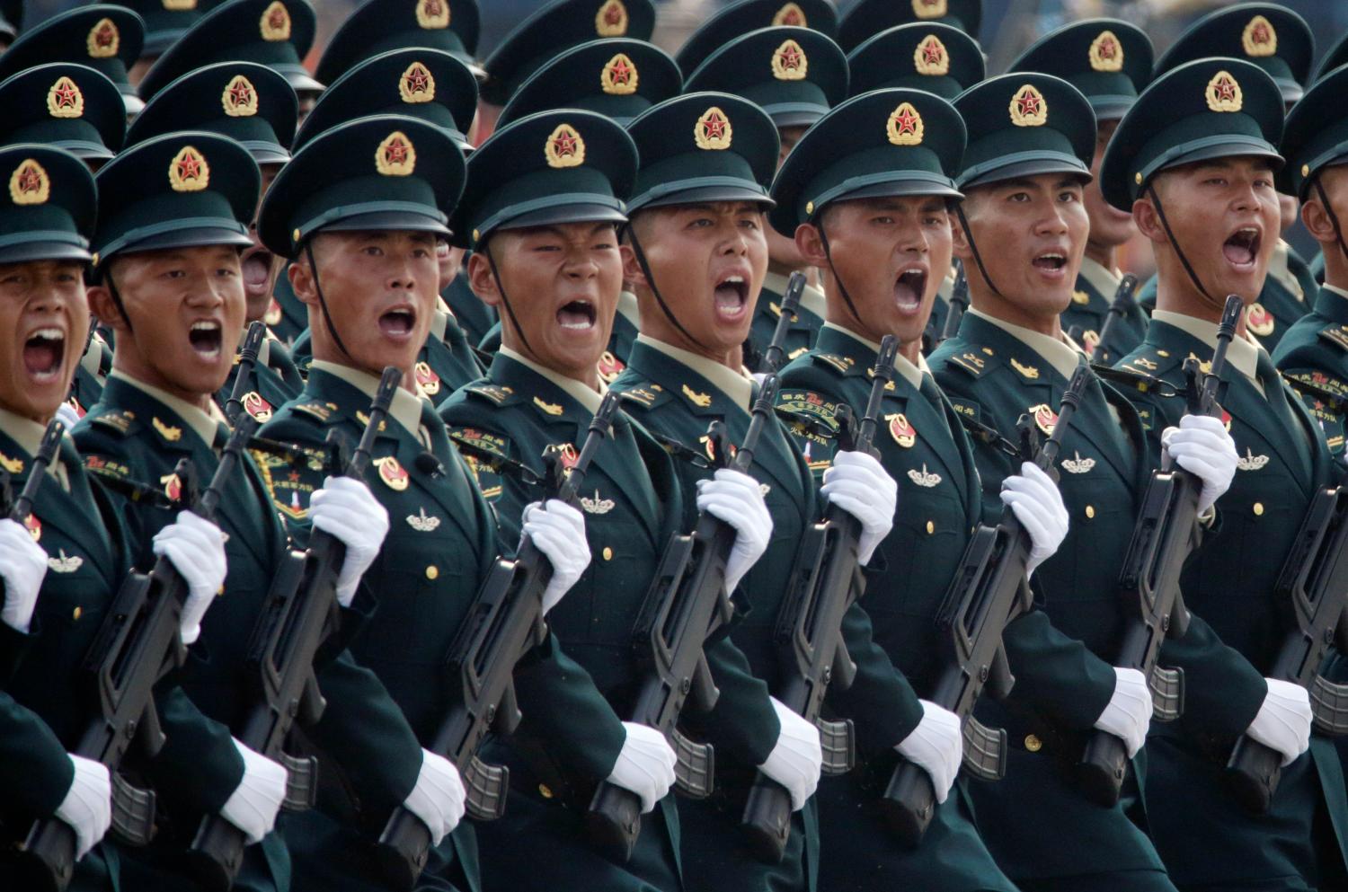 Soldiers of People's Liberation Army (PLA) march in formation past Tiananmen Square during the military parade marking the 70th founding anniversary of People's Republic of China, on its National Day in Beijing, China October 1, 2019. REUTERS/Jason Lee - SP1EFA10HSD12