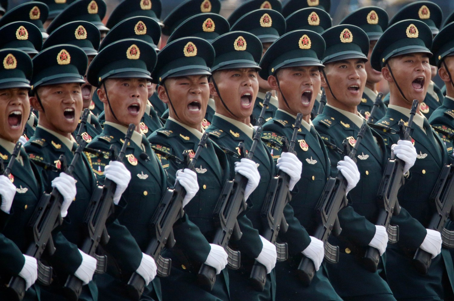 Soldiers of People's Liberation Army (PLA) march in formation past Tiananmen Square during the military parade marking the 70th founding anniversary of People's Republic of China, on its National Day in Beijing, China October 1, 2019. REUTERS/Jason Lee - SP1EFA10HSD12