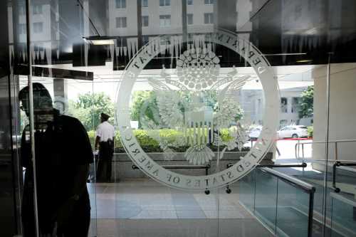An employee enters the State Department in Washington, U.S., June 2, 2017. REUTERS/Yuri Gripas - RC15D498D750