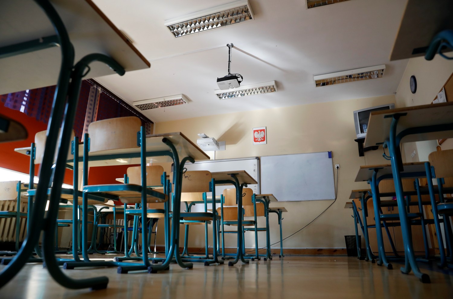 An empty classroom is seen.