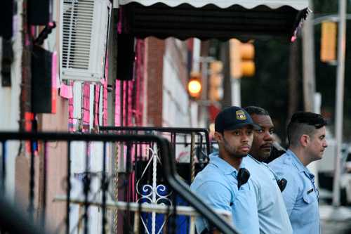Police stand near the scene during an active shooter situation, where Philadelphia police officers were shot during a drug raid on a home, in Philadelphia, Pennsylvania, U.S. August 14, 2019. REUTERS/Bastiaan Slabbers - RC1547B47150