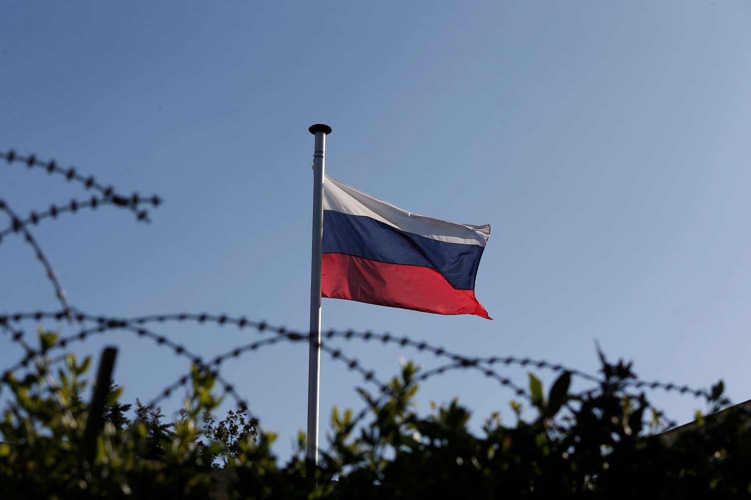 A Russian flag flutters atop the Russian consulate after an explosion, in Athens, Greece March 22, 2019. REUTERS/Costas Baltas - RC188C90E370