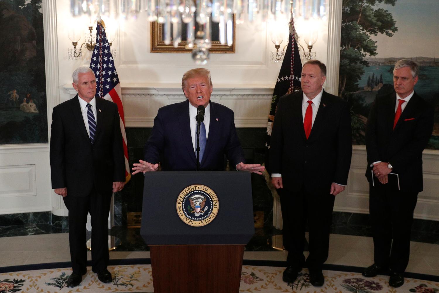 U.S. President Donald Trump delivers a statement on the conflict in Syria as Vice President Mike Pence, Secretary of State Mike Pompeo and White House National Security Advisor Robert OBrien stand by in the Diplomatic Room of the White House in Washington, U.S., October 23, 2019. REUTERS/Tom Brenner - RC1CA1D434F0