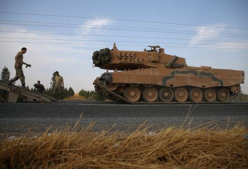 Turkish army tank is being unloaded on a road near the Turkish border town of Ceylanpinar, Sanliurfa province, Turkey, October 18, 2019. REUTERS/Stoyan Nenov - RC1C41D0BF40