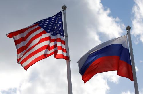 Russian and U.S. state flags fly near a factory of Ford Sollers, a joint venture of U.S. carmaker Ford with Russian partners, in Vsevolozhsk, Leningrad Region, Russia March 27, 2019. REUTERS/Anton Vaganov - RC1A71E02390