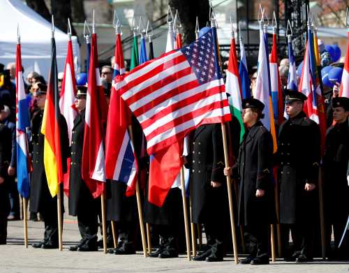 Lithuanian Military Academy students hold NATO membership states flags during the celebration of the the 15th anniversary of Lithuania's membership in NATO in Vilnius, Lithuania March 30, 2019. REUTERS/Ints Kalnins - RC1B87408B50